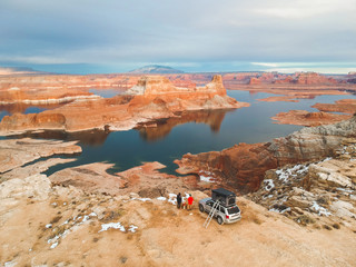 People standing by car at Lake Powell