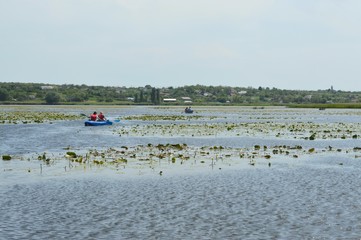 People on a boat on the river