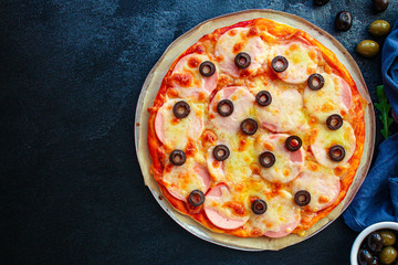 pizza sausage salami, olives and cheese. Menu concept food background. top view. copy space for text