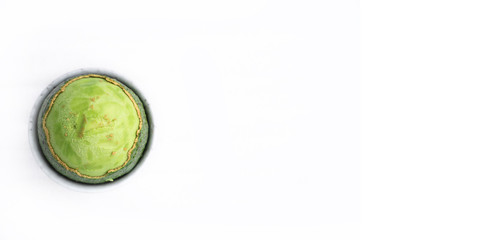 peeled on top of a ripe fresh avocado with a fleshy pulp. Isolated. Banner. Green concept. Flat lay
