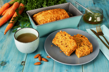 Delicious vegan carrot cake on turquoise blue background