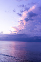 Waves and clouds. Blue ocean Beautiful sunset at Balangan Beach on the island of Bali in Indonesia. Surfers catch the waves, tourists relax and enjoy the sunset or sunrise