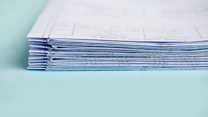 Stack Folding drawings on a blue background. Copy space.