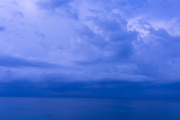 Waves and clouds. Blue ocean Beautiful sunset at Balangan Beach on the island of Bali in Indonesia. Surfers catch the waves, tourists relax and enjoy the sunset or sunrise