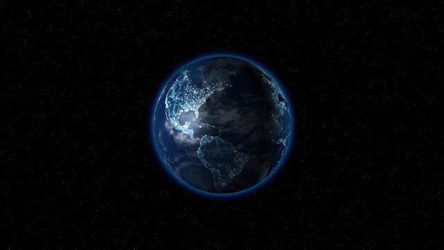 The earth with its glowing cities rotates