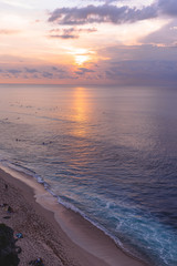 Waves and clouds. Blue ocean Beautiful sunset at Balangan Beach on the island of Bali in Indonesia. Surfers catch the waves, tourists relax and enjoy the sunset or sunrise