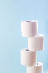 Rolls of toilet paper on color background