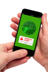 Covid-19 alert popup on a smartphone screen. Concept for app to trace and help keep safe distance.