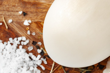Soap bars with natural ingredients on the table, close up.