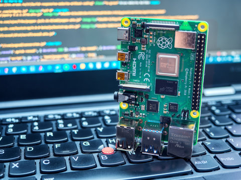 Galati, ROMANIA - March 22, 2020: Close-up of a Raspberry Pi 4 Model-B on a laptop keyboard. The Raspberry Pi is a credit-card-sized single-board computer developed in the UK