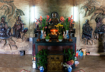 Inside White Buddha Statue at Long Son Pagoda in sunny day at Nha Trang, Vietnam.