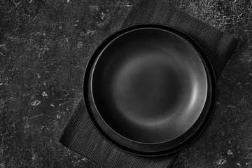 Top view of an empty black plate
