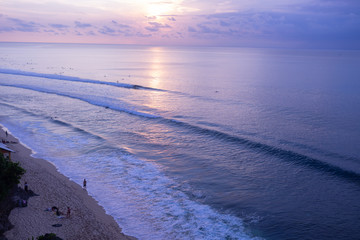 The beautiful nature of Indonesia and the island of Bali. Slopes and cliffs overlooking the waves of the blue ocean. Tropical and exotic view of travel to Asia