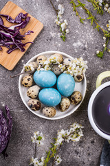 Process of painting Easter eggs in blue