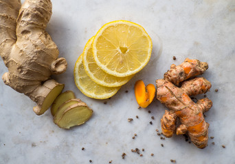Ginger and turmeric roots and lemon slices