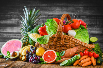 Composition with assorted raw organic fresh vegetables. Assortment of fruits and vegetable. Healthy raw detox food diet concept.