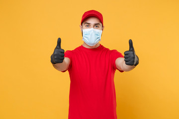 Delivery man in red cap blank t-shirt uniform sterile face mask gloves isolated on yellow...
