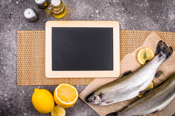 Raw uncooked trout with lemon