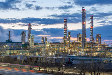 Petrochemical industrial plant in the evening with backlight against a beautiful sky