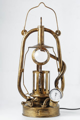 fantastic product in steampunk style, table lamp with from a kerosene lamp with additional valves on a white background