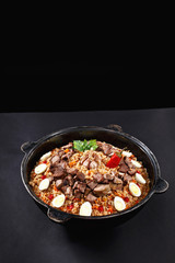 Vertical shot of pilaf. Traditional Uzbek dish plov. Same like biryani in India. Family portion. Best concept for promotion