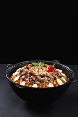 Vertical shot of pilaf. Traditional Uzbek dish plov. Same like biryani in India. Family portion. Best concept for promotion