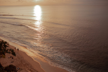 The beautiful nature of Indonesia and the island of Bali. Slopes and cliffs overlooking the waves of the blue ocean. Tropical and exotic view of travel to Asia