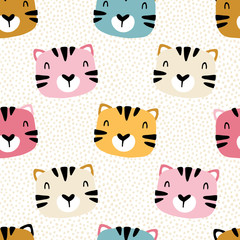 Tiger kitten with polka dots. Seamless pattern with cute animals faces. Childish print for nursery in a Scandinavian style. For baby clothes, packaging. Vector cartoon illustration in pastel colors.