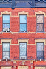 Fototapeta na wymiar Red brick facade in west side of Manhattan in New York.