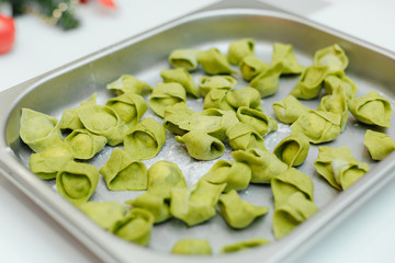 Green spinach dough ravioli ready to cook