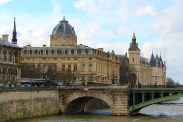 Fototapeta na wymiar View of the old stone buildings with towers and a bridge over the River Seine.