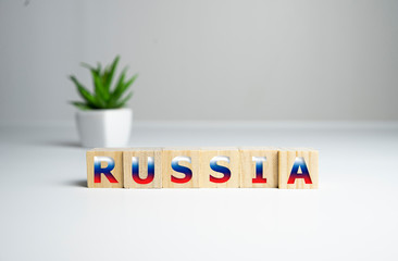 Text sign showing word Russia on wooden cubes. Text on white background