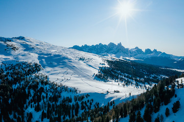 Sunny winter landscape at Ski Area in Dolomites, Italy - Alpe Lusia. Ski resort in val di Fassa...