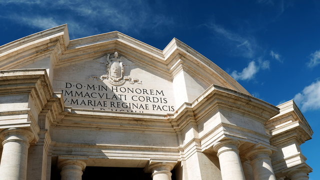 Rome, Italy - September 08, 2019: Main facade of the Basilica of the Sacred Heart Immaculate of Mary, in Piazza Euclide in Rome. with a Greek cross plan inscribed in a circle and an elaborate facade