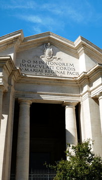 Rome, Italy - September 08, 2019: Main facade of the Basilica of the Sacred Heart Immaculate of Mary, in Piazza Euclide in Rome. with a Greek cross plan inscribed in a circle and an elaborate facade