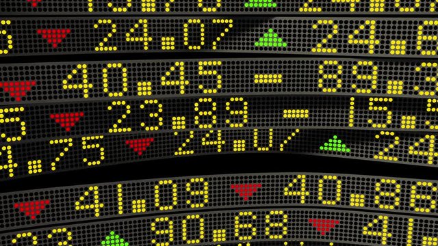 Wall Street stock market tickers sliding on trading boards
