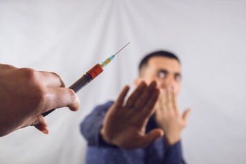 businessman refuses an injection