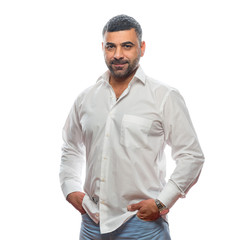 Arab casual man in a white shirt posing in the studio on the white background
