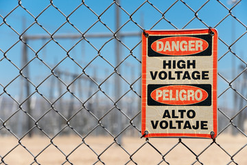 Warning Sign High Voltage for electrical transfer station on a chain link fence