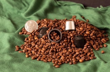 by filling coffee capsules dipped in espresso beans