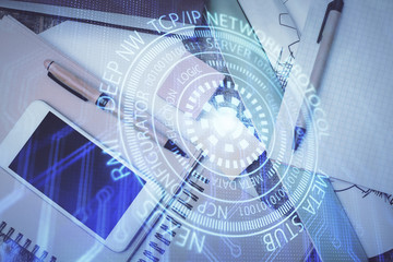 Obraz premium Multi exposure of technology theme drawing over work table desktop. Top view. Global data analysis concept.