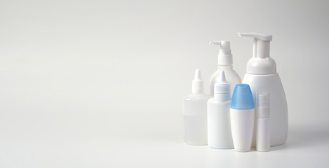 Medical antiseptic and hygiene products, hand sanitizers are used to destroy microbes, bacteria and viruses: gel, antibacterial agent, alcohol solution, medical solution. White bottles on a white