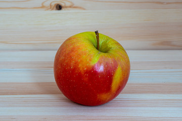 Red fresh apple on wood table