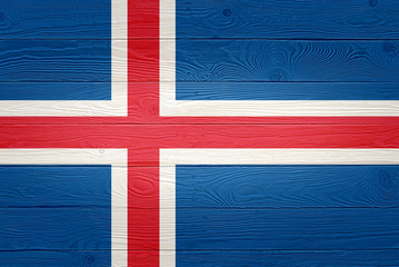 Iceland flag painted on old wood plank background. Brushed natural light knotted wooden board texture. Wooden texture background flag of Iceland.