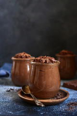 Homemade delicious chocolate mousse in a glass jars.
