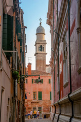 historic church and the heart of venice. narrow street. venice. italy
