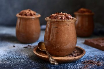 Homemade delicious chocolate mousse in a glass jars.