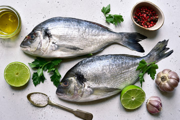 Raw dorado fish with ingredients for making. Top view with copy space.