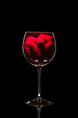 Glass of wine in black background