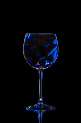 Glass of wine in black background